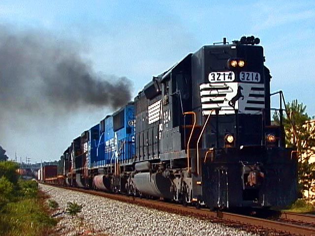 SD40 2 #3214 leads northbound manifest train #322 through Locust Grove